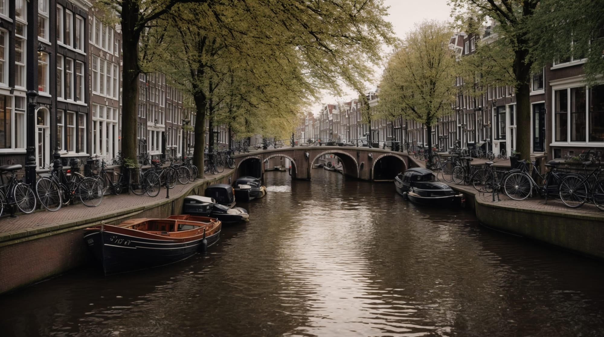A serene view of Amsterdam canals with traditional Dutch architecture in the background