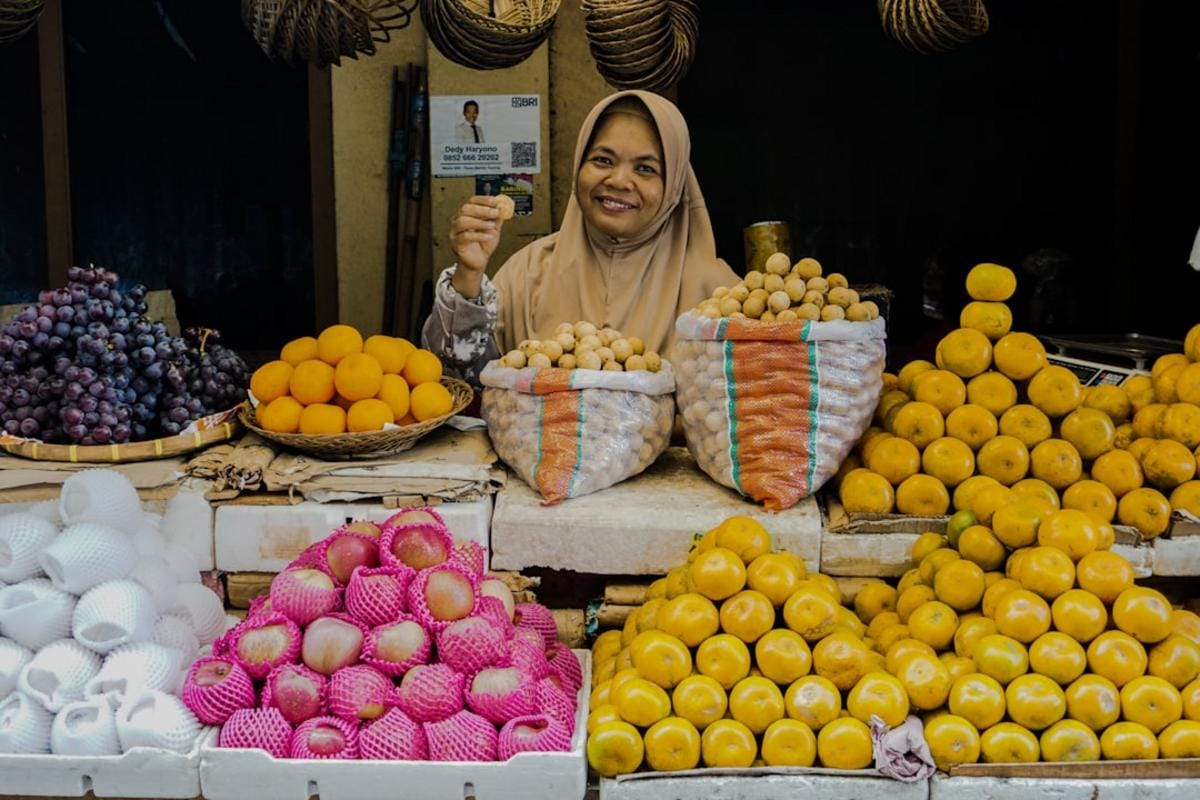 bargaining tips Close-up of a traveler negotiating a price with a local vendor at a busy market stall