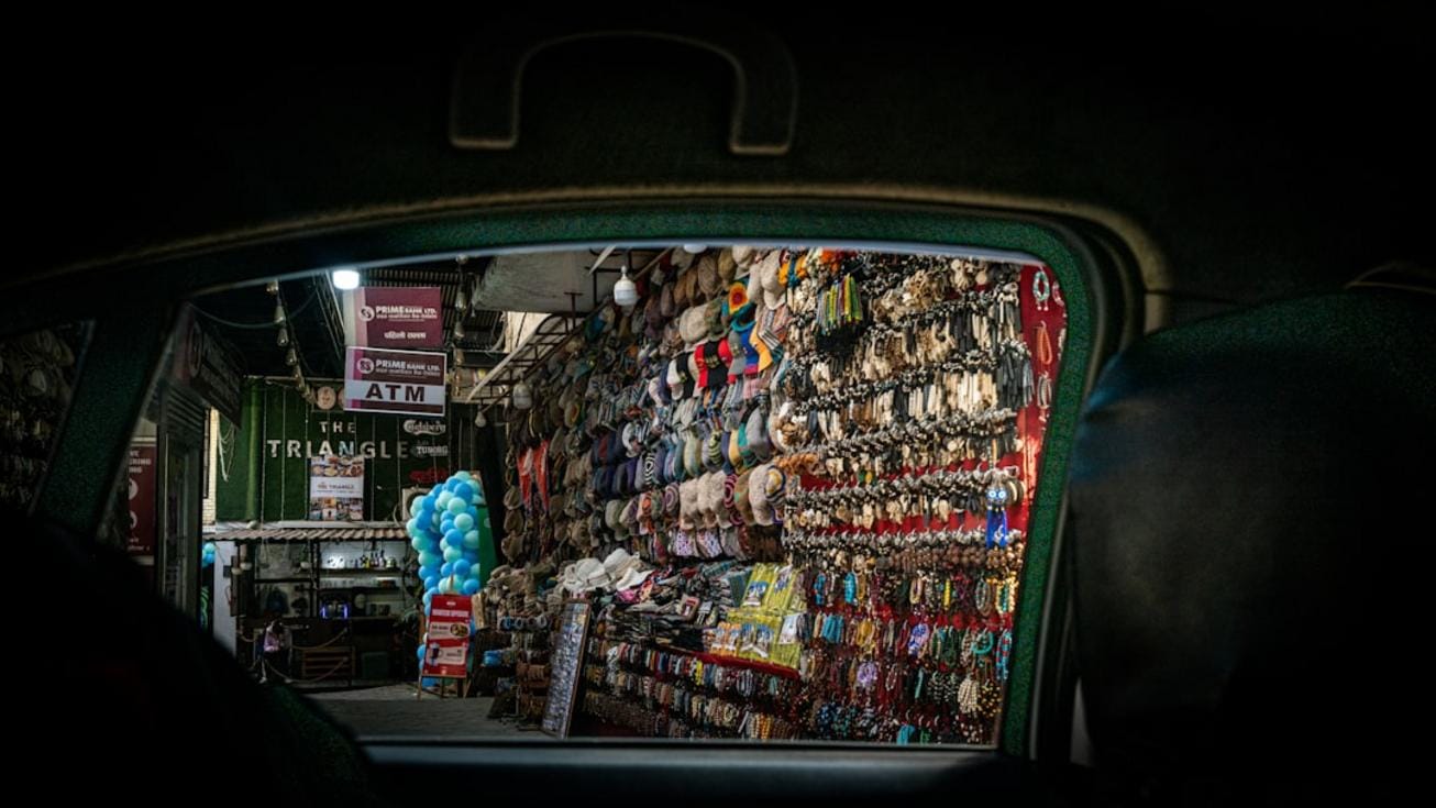 A lively depiction of a bustling Amsterdam street market with diverse crowds enjoying local foods and crafts