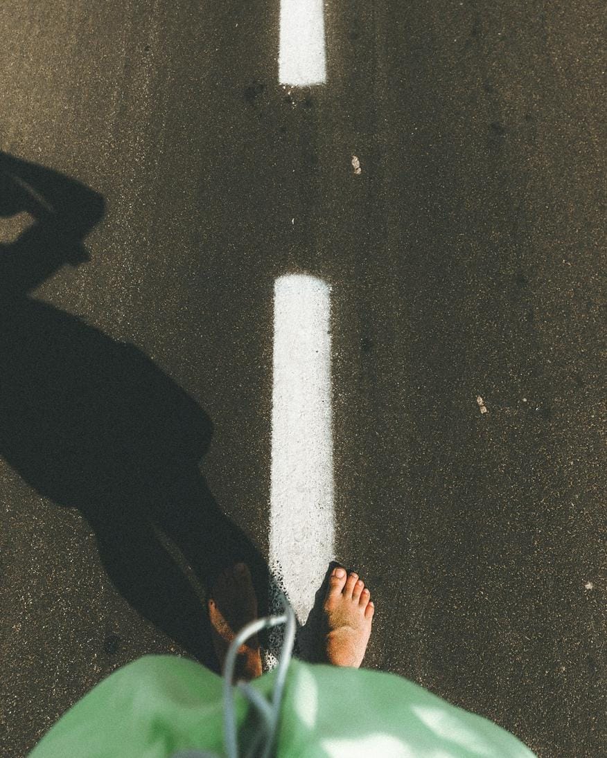 Vibrant street art on NDSM Wharf with people walking and cycling