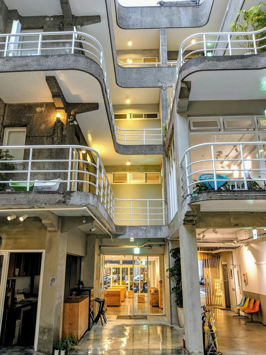 cozy hostel interior with communal seating and bunk beds