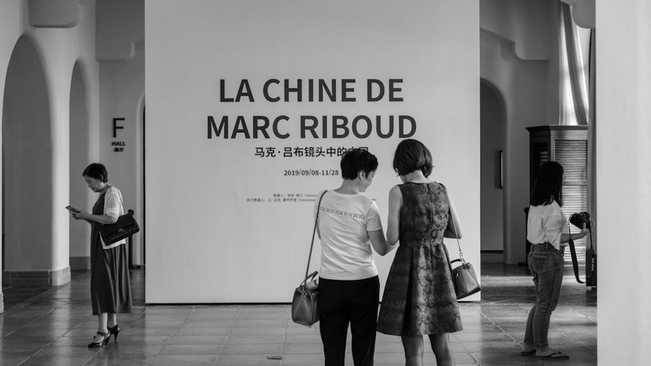 Exterior view of the Rijksmuseum with visitors admiring the masterpieces inside