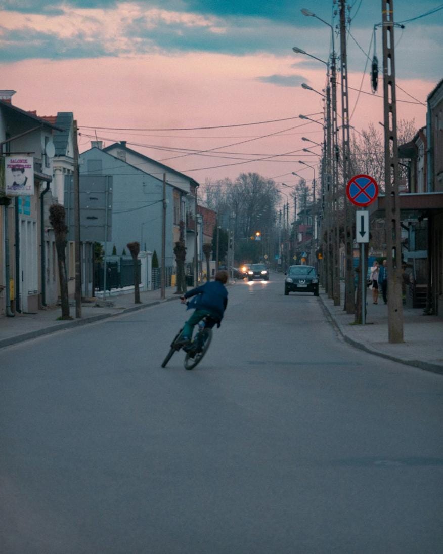 Colorful street scene in De Pijp neighborhood with cafes, markets, and diverse residents