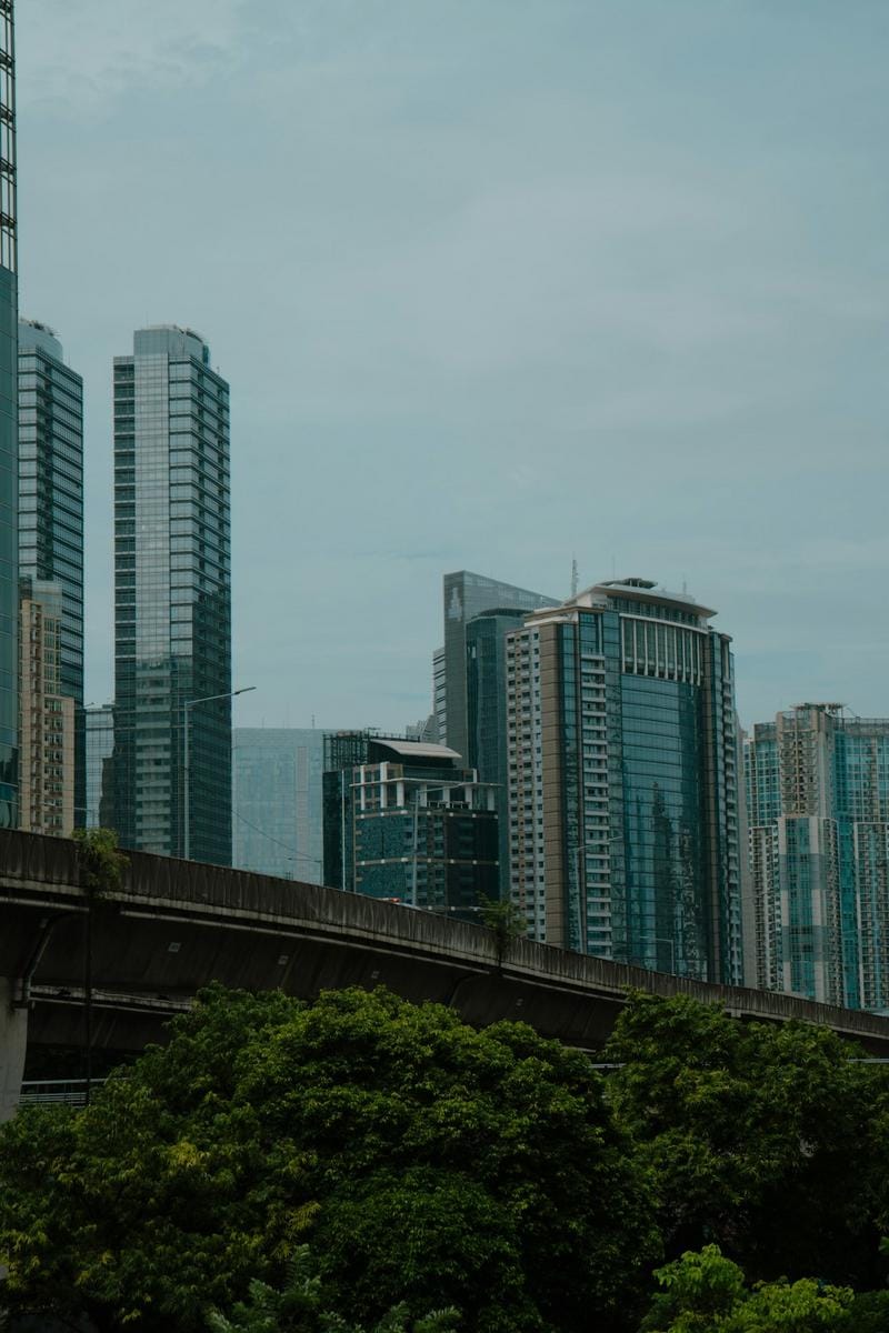 A vibrant city square bustling with tourists on a guided city tour, showcasing historic buildings, street performers, and local cafes, capturing the lively essence of urban exploration.