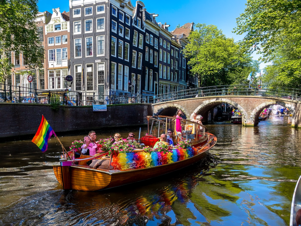Amsterdam Celebrates Pride with Vibrant Boat Parade Highlighting Festivity and Activism